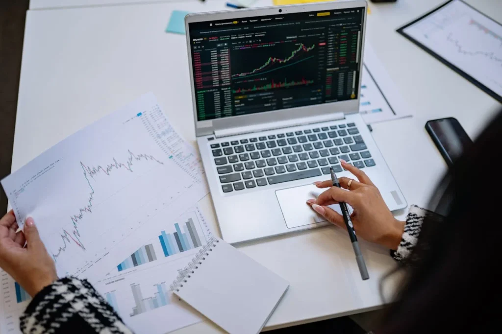 Fintechzoom.io review with stock charts, crypto icons, and online financial safety visuals